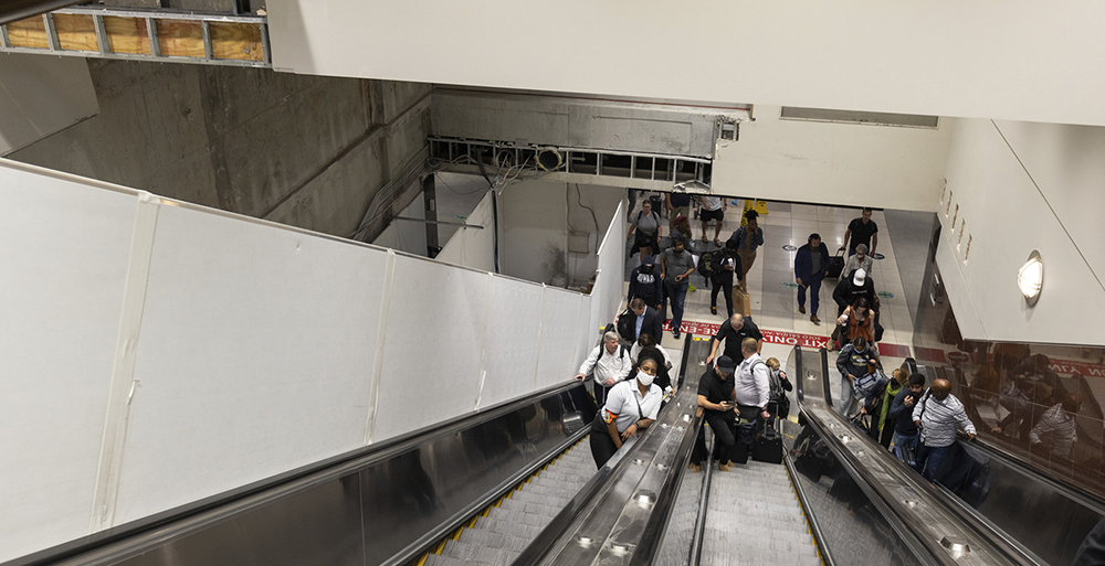 To support the 15-20% passenger capacity increase, the joint venture is installing additional escalators (top photo) and elevators (bottom photo) to deliver passengers from the APM station platform to the Domestic Terminal Boarding/Ground Transportation level.