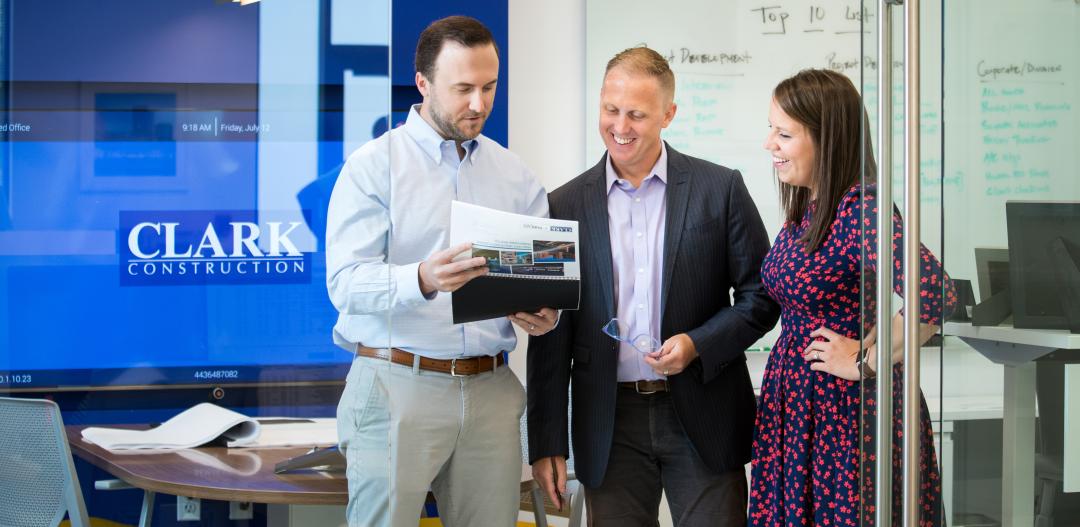 Three team members work together in a Clark office