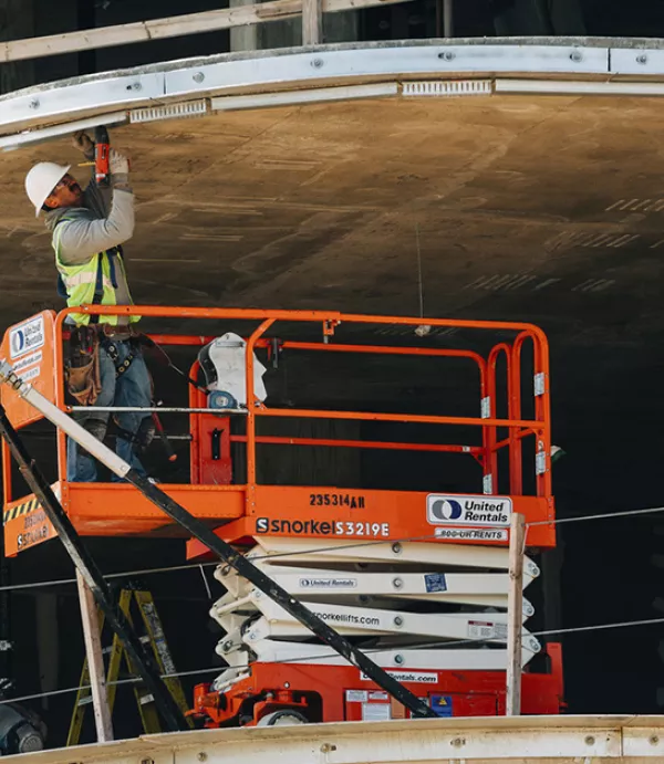 Craft worker in action; Twinbrook Quarter Phase 1 Progress Photography