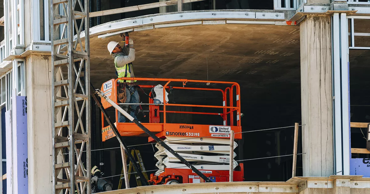Craft worker in action; Twinbrook Quarter Phase 1 Progress Photography